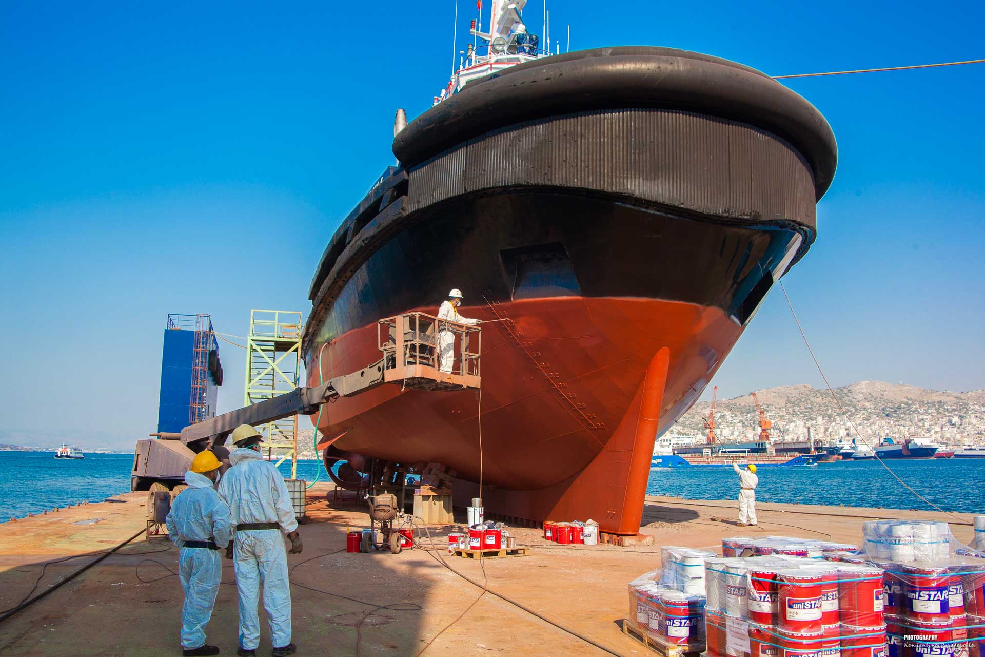 Slideshow - Our People 3 - Workers in front of cargo boat